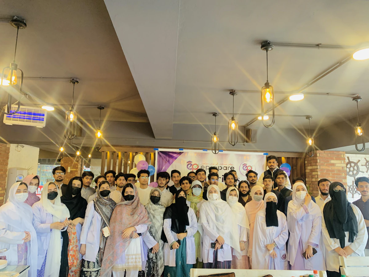 ePrepare students now at KMC and KGMC together in front of the ePrepare banner at the get-together in Peshawar